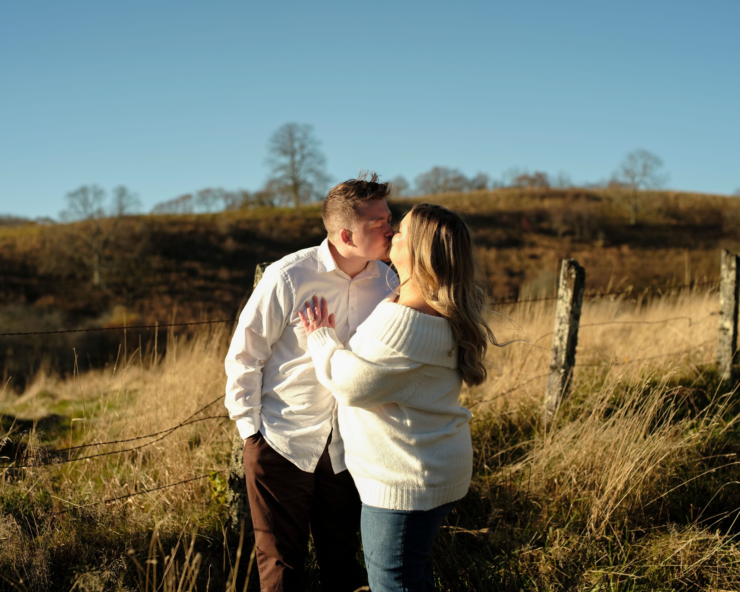 Aaryn and Braden in a golden mountain field